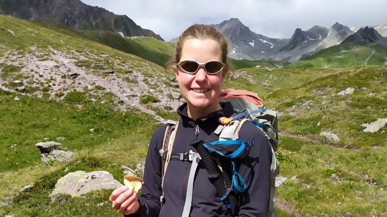 Esther Dingley hiking and smiling