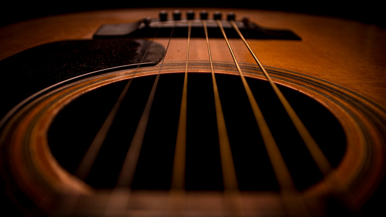 strings of an acoustic guitar