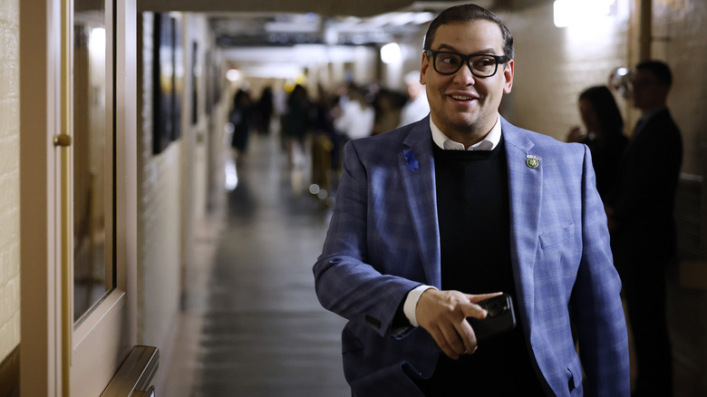 George Santos walks down hall, Capitol Hill