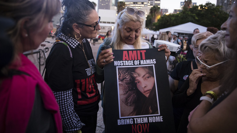 Israeli demonstrator w/picture of hostage