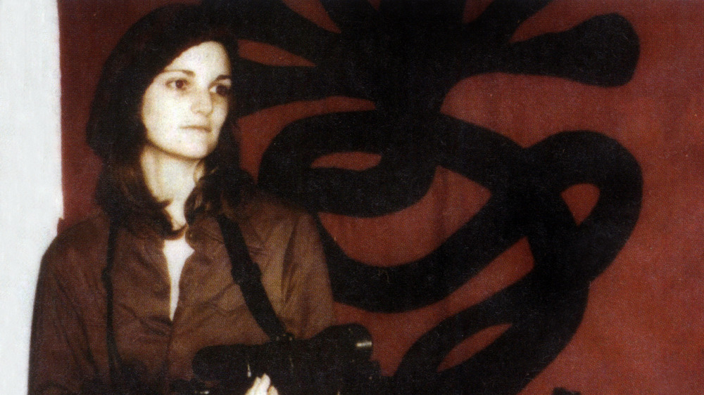 Patty Hearst robbing a bank with the SLA