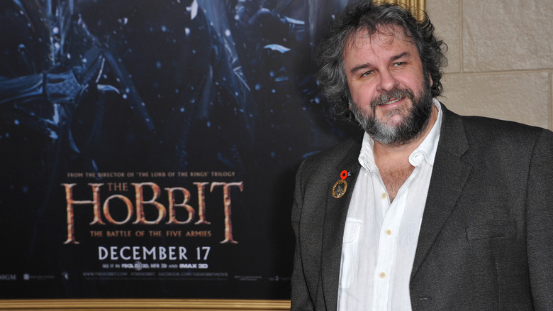 Peter Jackson with a poster for The Hobbit