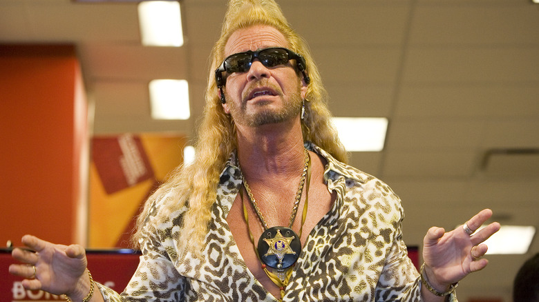 Duane Chapman in sunglasses gesturing 