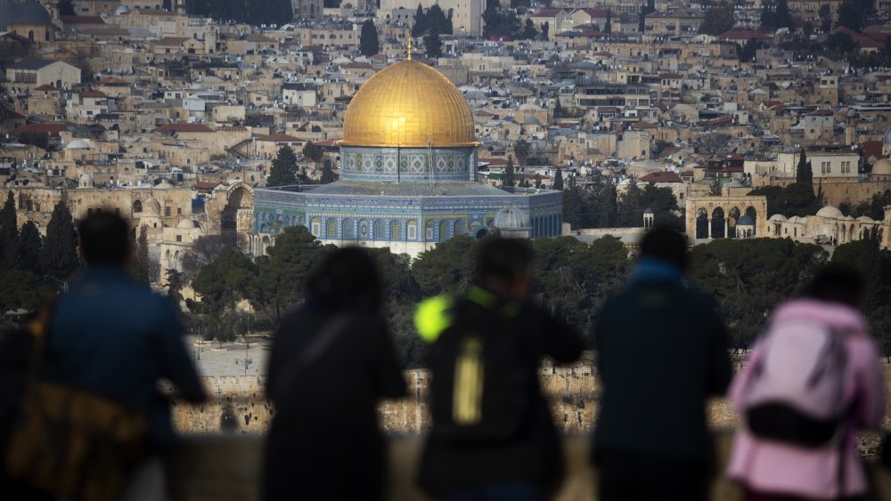 Tourists in Jerusalem looking over the Temple Mount
