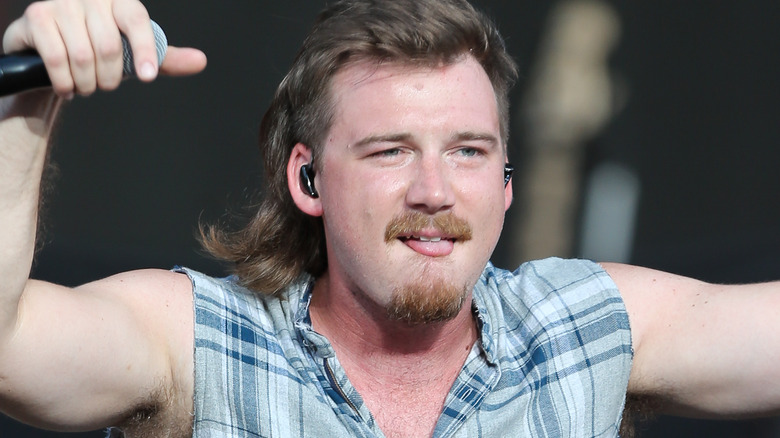 Morgan Wallen flexing tongue out