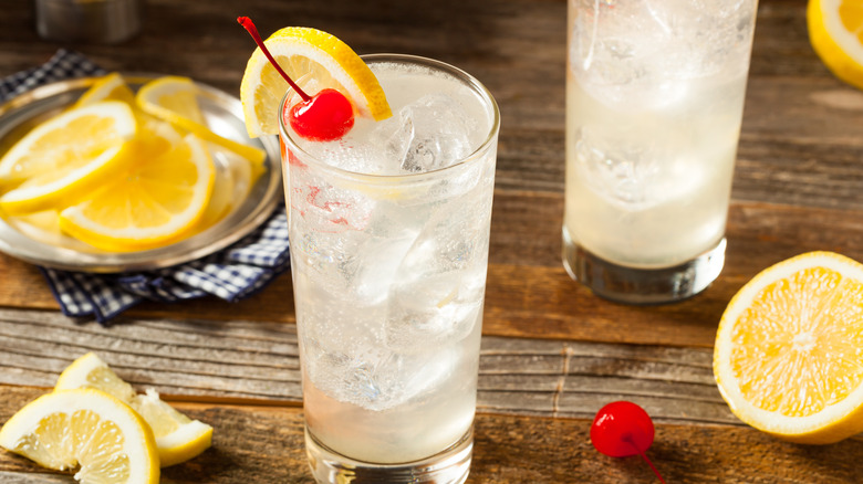 Tom Collins cocktails with lemons and cherries