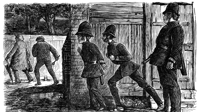 Police officers chasing suspects