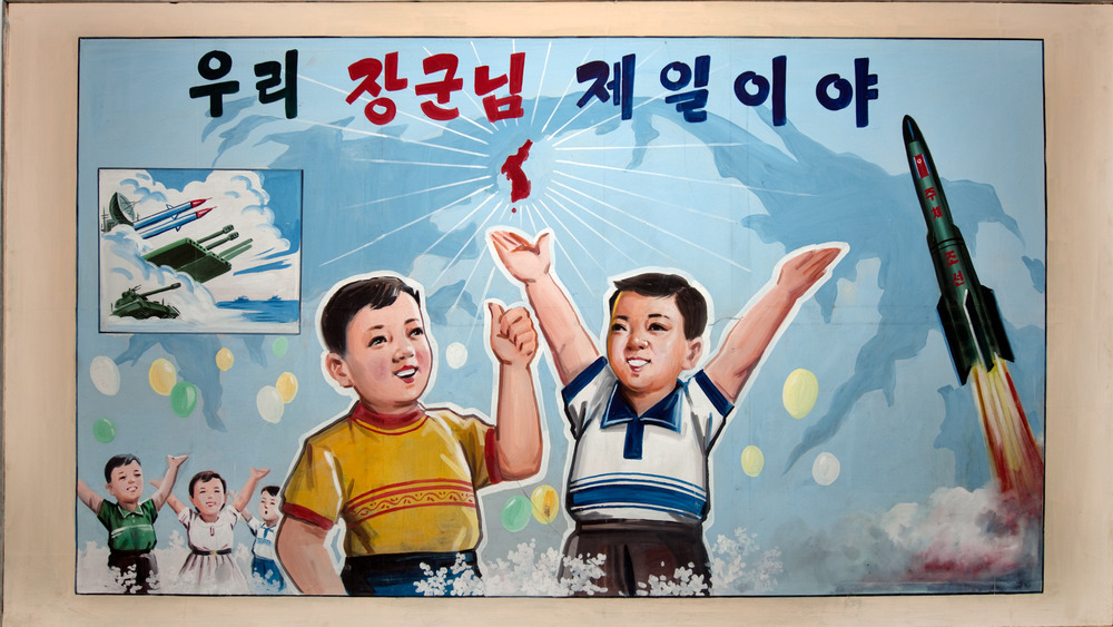 poster depicting young boys amidst missiles