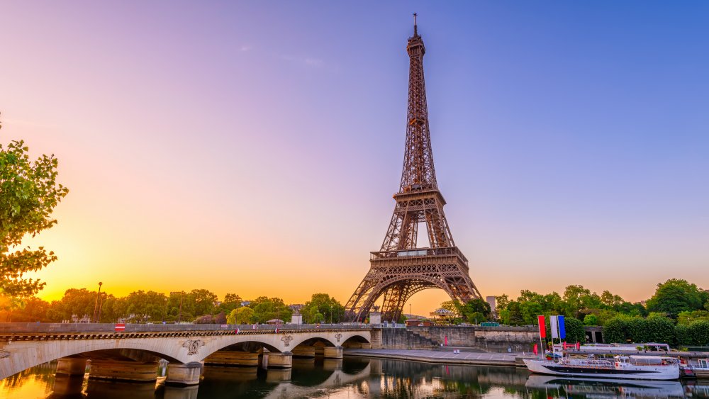 View of Eiffel Tower and river Seine at sunrise in Paris, France.