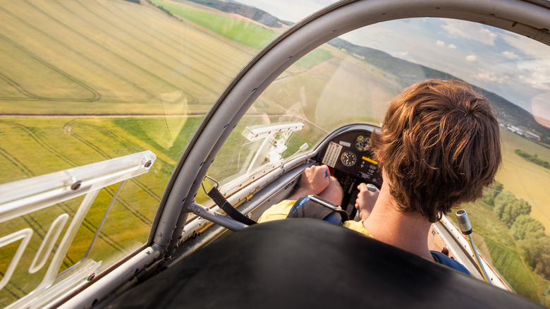 man landing a plane