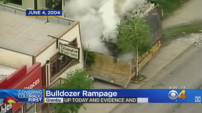 screenshot of news report of killdozer striking building