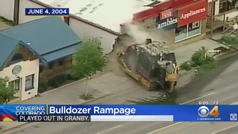 screenshot of news report of killdozer striking building