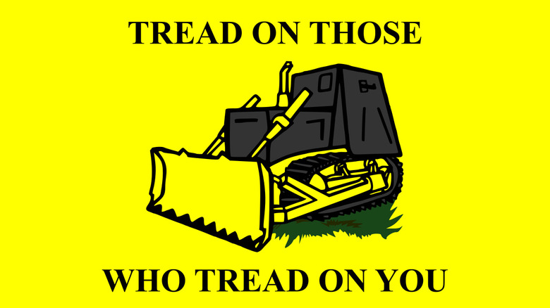 gadsden flag with bulldozer and caption "tread on those who tread on you"