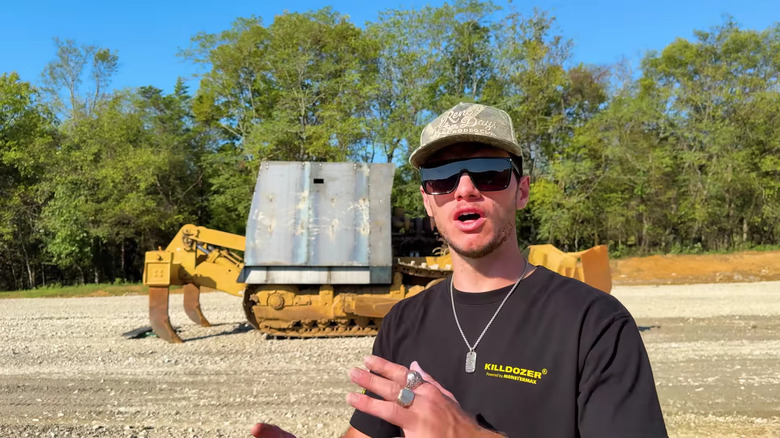 screenshot from whistlindiesel video featuring host and killdozer replica