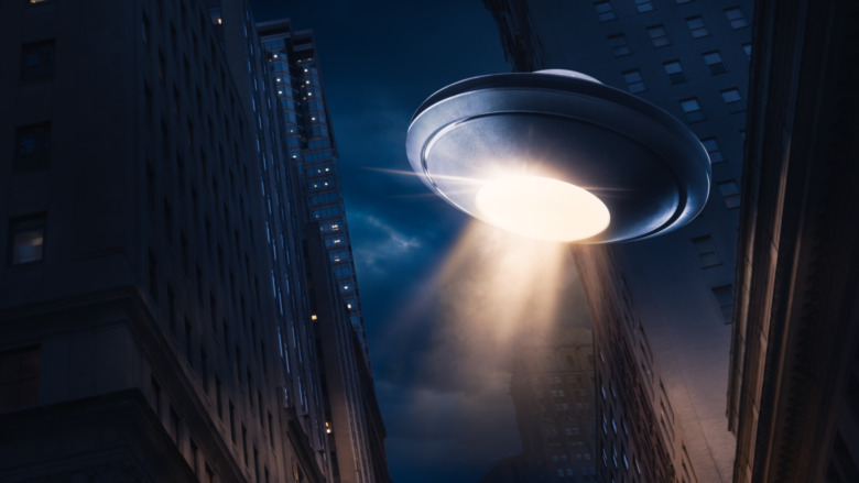 Flying saucer over a city