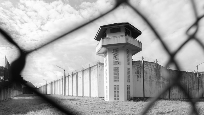 prison behind a fence