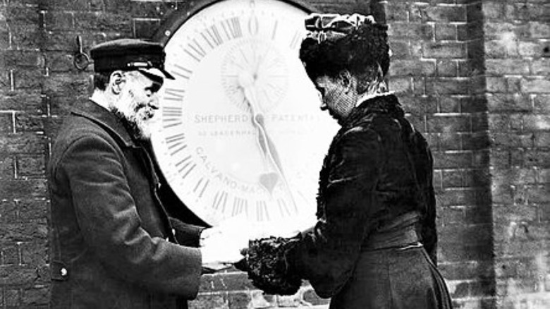 Ruth Belville showing time to a man at Greenwich Observatory