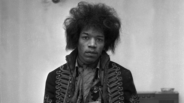 Jimi Hendrix staring into the camera.