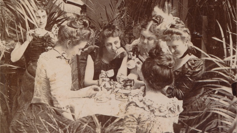 Victorian women reading tea leaves