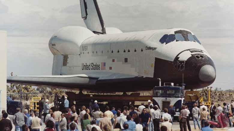 Challenger sitting on the ground crowd of people