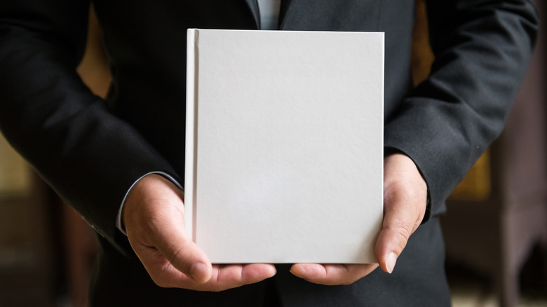 Man with blank paper