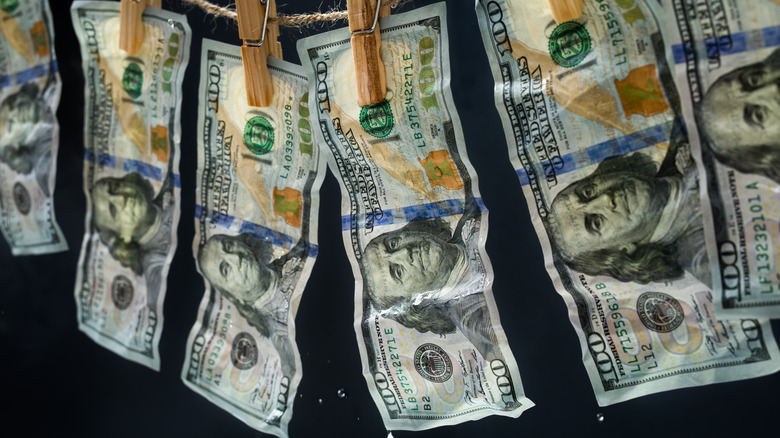 money hanging from clothesline