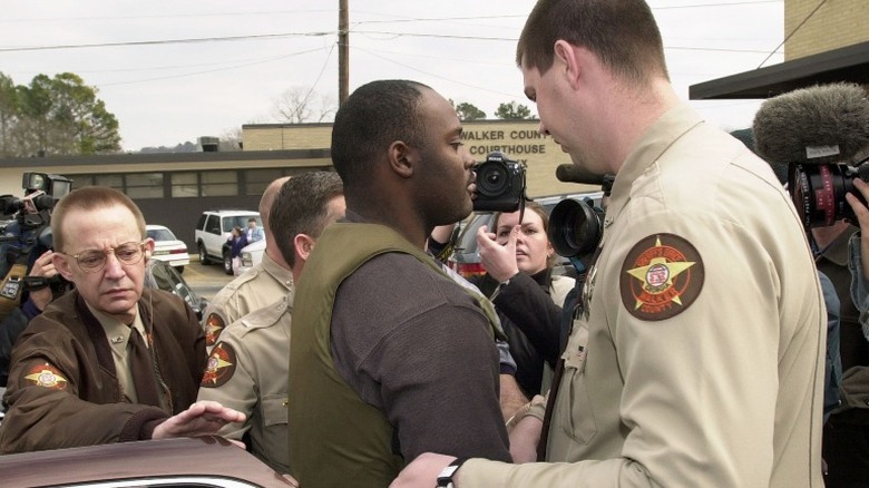 Ray Brent Marsh going into a bond hearing in 2002