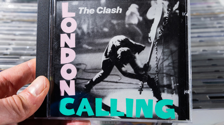 The Clash London Calling CD cover being held over other CDs