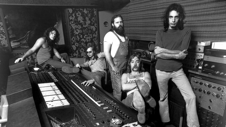 Steely Dan posing in the control room of a studio.