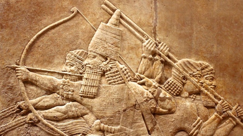 Ancient Mesopotamian soldiers carved into stone