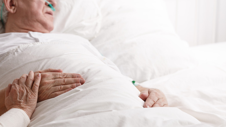 sick man lying on bed