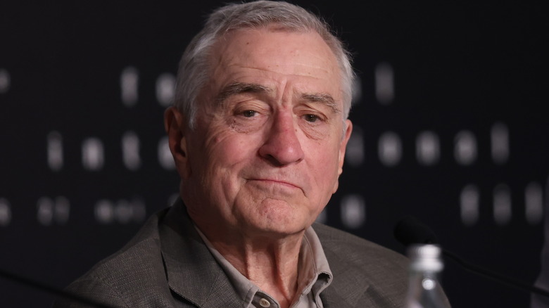 Robert De Niro suit smirking