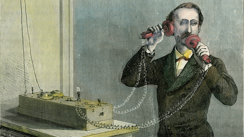 Using Alexander Graham Bell's telephone