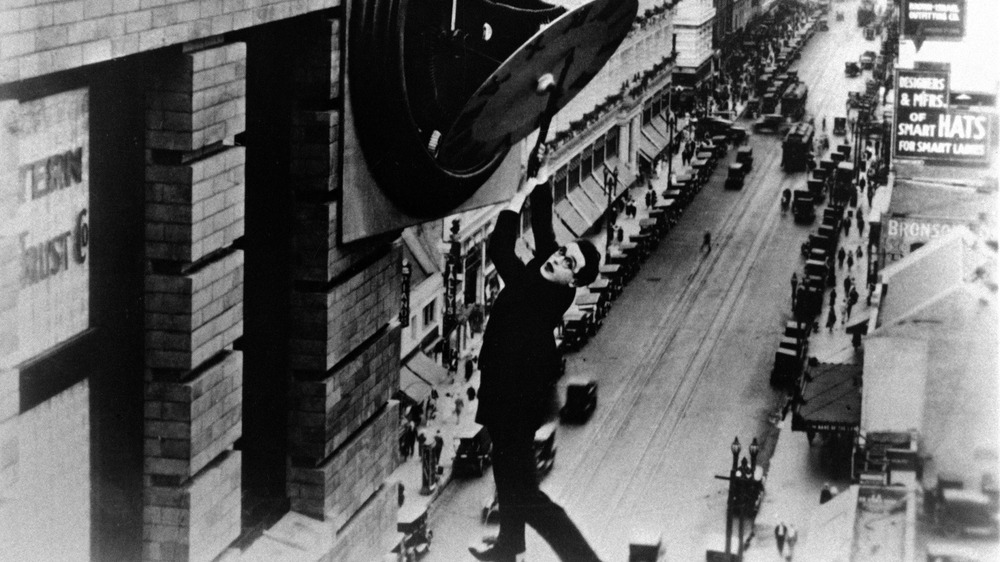 Harold Lloyd hanging from a clock in Safety Last!