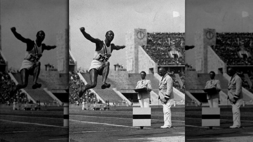Jesse Owens air during the long jump at the Olympic Games in Berlin