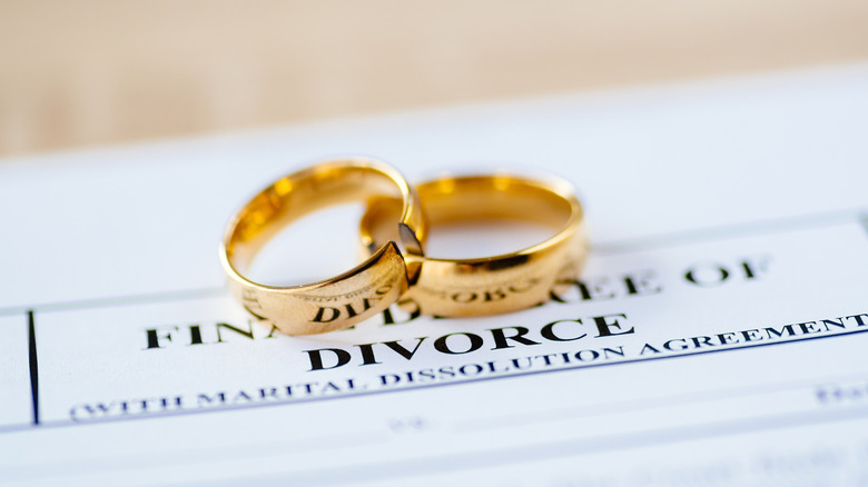 wedding rings on a divorce document