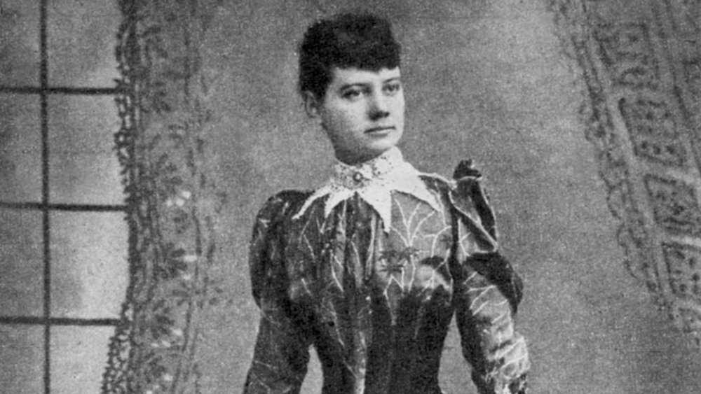 Nellie Bly standing