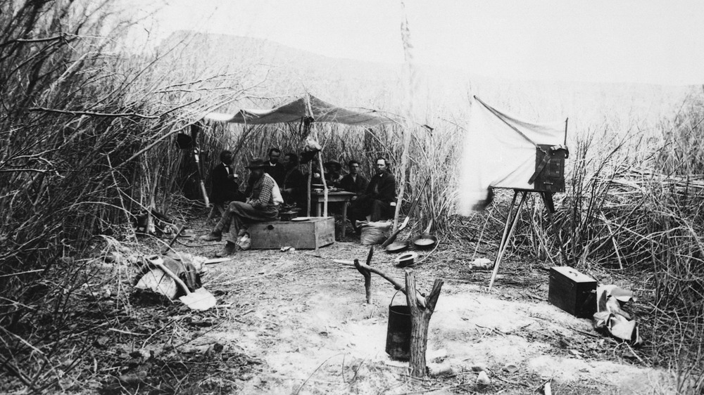 First camp of the second John Wesley Powell expedition, in the willows, Green River, Wyoming, 1871. There were no photographs taken on the 1869 expedition.