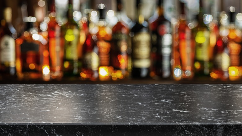 Gray table top and bokeh shelves