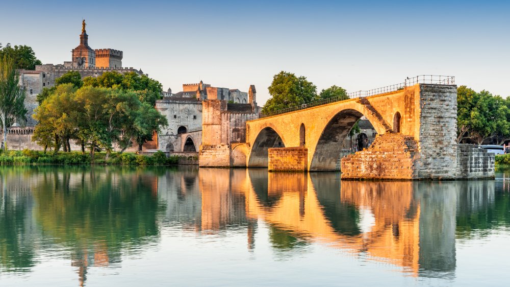 Avignon Bridge with Popes Palace and Rhone River at sunrise, Pont Saint-Benezet, Provence, France.