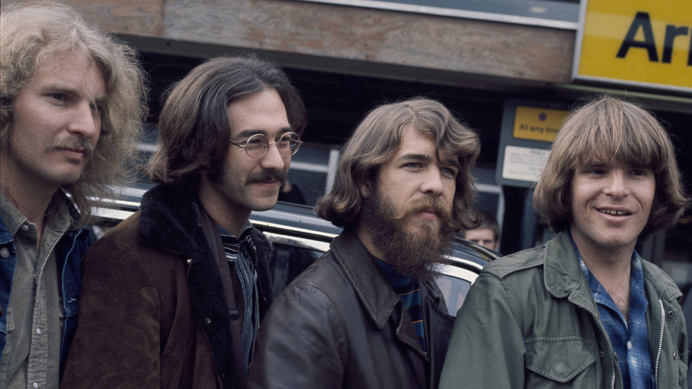 the members of Creedence Clearwater Revival on a bench