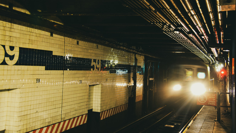 Subway station with train approaching