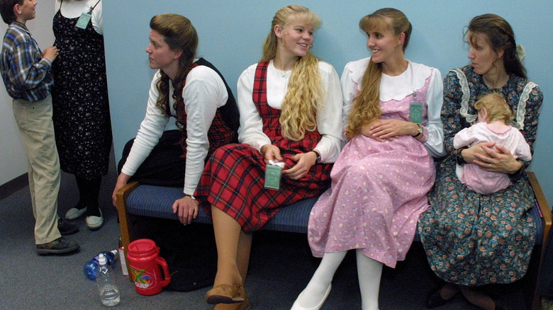 four women in dresses