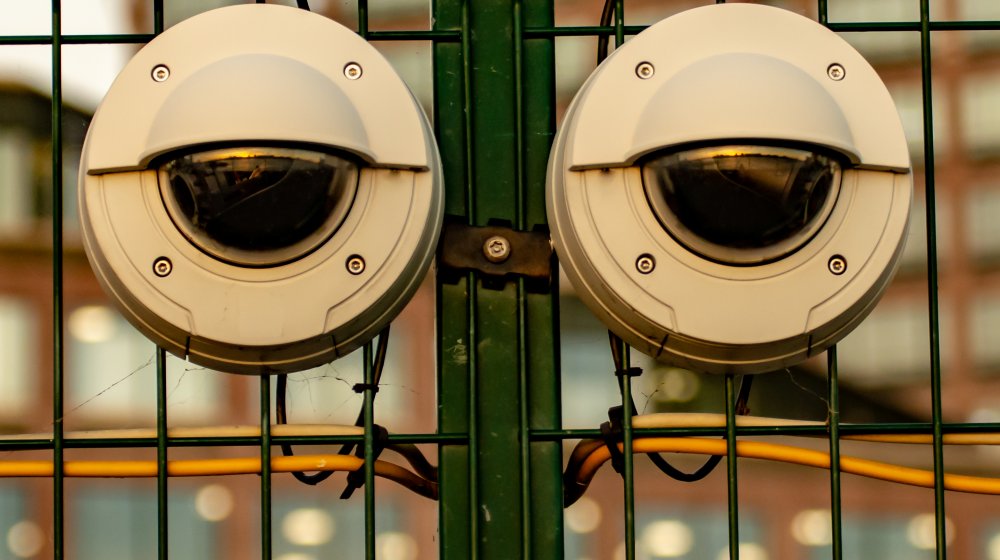 A pair of security cameras that look like human eyes.