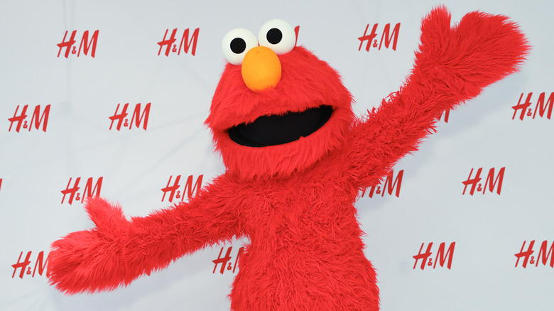 Elmo hands out
