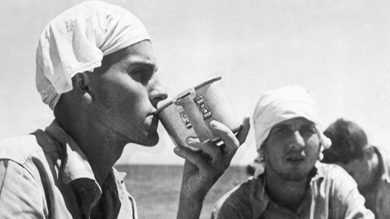 American prisoners of war with headscarves drinking