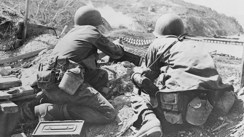 Two U.S. soldiers operating machine gun