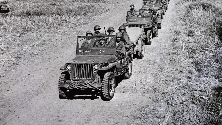 American soldiers in military vehicles driving toward Manila, Phillipines