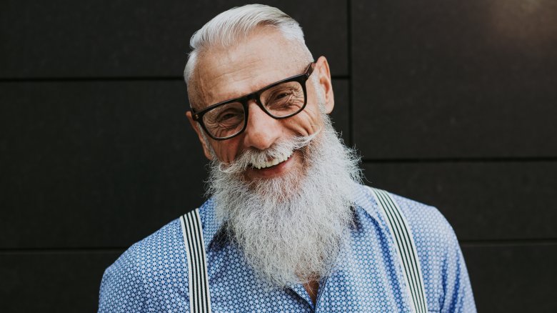 Smiling senior hipster