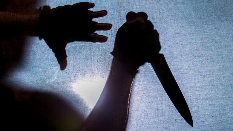 shadow figures with a knife